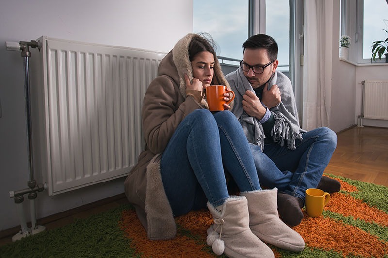 Cold Couple Next to Radiator